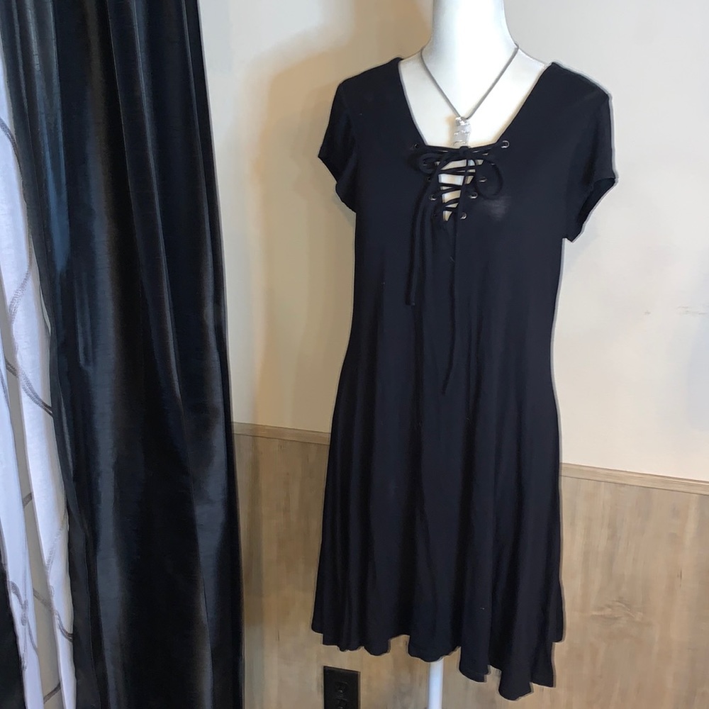 Boutique purchase from Nashville, TN. Lace up front. Flows, high low hem.